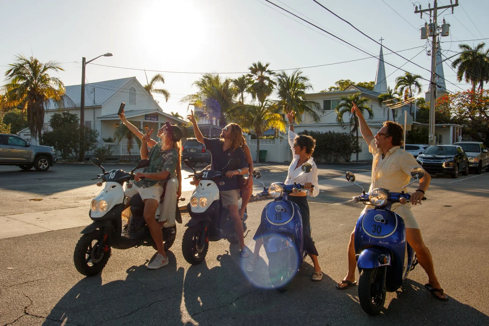 Group of friends on HydroThunder scooter rentals at sunset in Key West